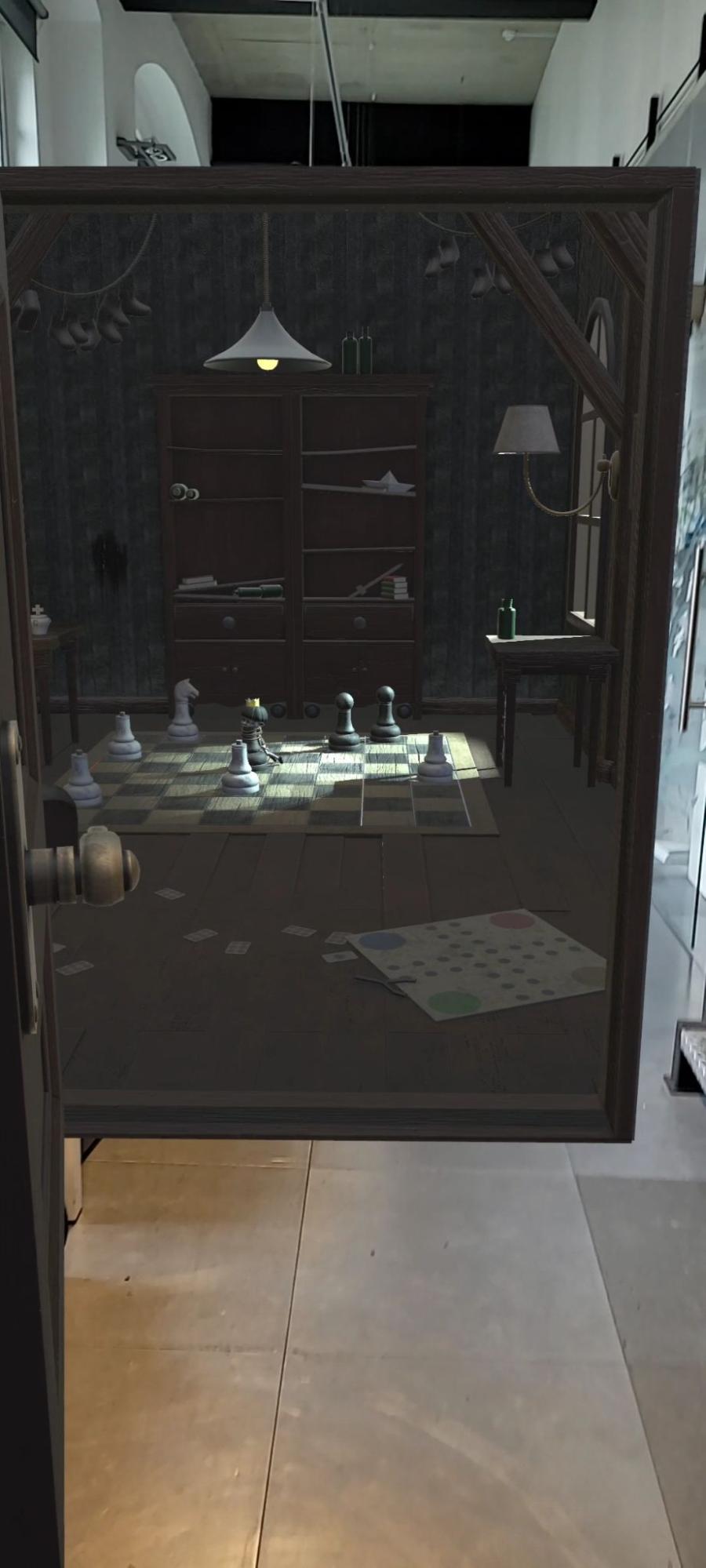 Phone screenshot of the AR portal door, showing the puzzle room appearing through the doorway in the real office space